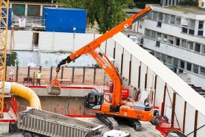 Telescopic arm excavators